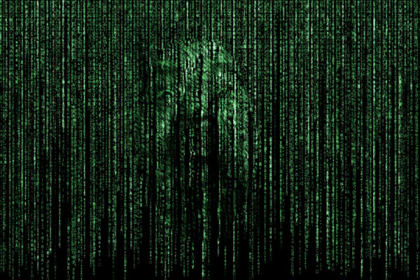 Matrix-like green code with a face emerging.