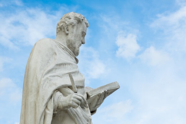 A statute in front of the Baroque style of Parish Church in Laxenburg, Lower Austria, Austria.